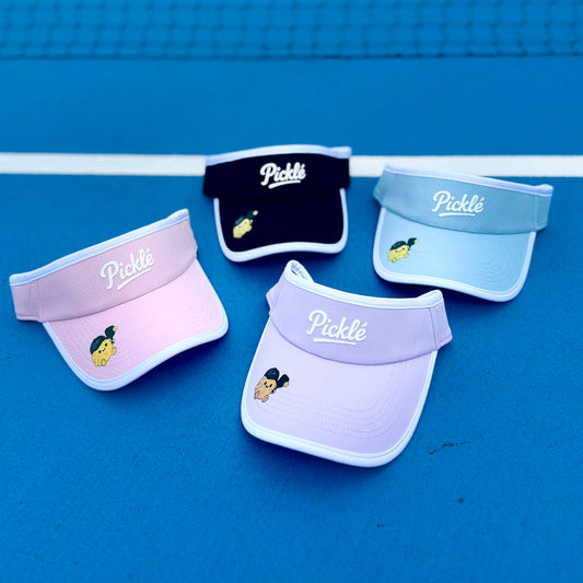 Four visors with 'Pickle' branding on a blue background